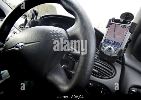 A Pocket PC GPS system mounted in a car Stock Photo