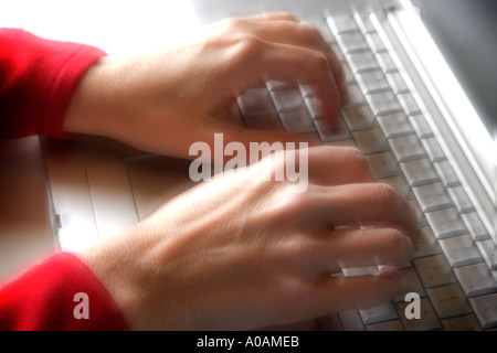 Woman using a laptop Stock Photo