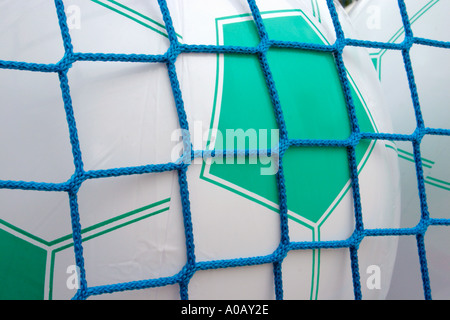 Inflatable footballs at fairground stall Stock Photo