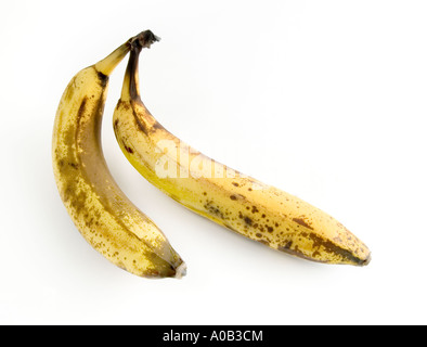 two bananas; 2 bananas; old bananas; yellow bananas; banana skin; banana; tropical fruit; pair of bananas; couple; white bg Stock Photo