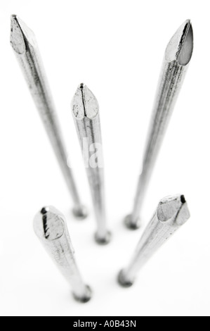 iron nails; metal nails; six inch nails; 6 inch nails; five; 5; point; hammer; sharp; bed of nails; iron; iron mongery; cut out; Stock Photo