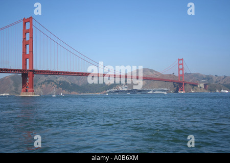 US Navy aircraft carrier USS Nimitz (CVN 68) passing under Golden Gate Bridge San Francisco during Fleet Week  October 2006 Stock Photo