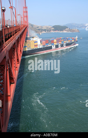 container ship passing under Golden Gate Bridge San Francisco California  October 2006 Stock Photo