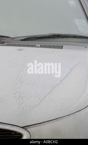 Winter motoring ice and frost on car bonnet Stock Photo