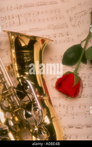 Red Roses And Saxophone Red rose, saxophone and music sheet on a white background Stock Photo ...