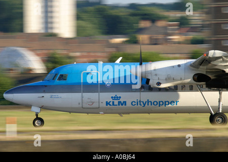 Commercial aircraft Fokker 50 KLM taking off at London City Airport Stock Photo