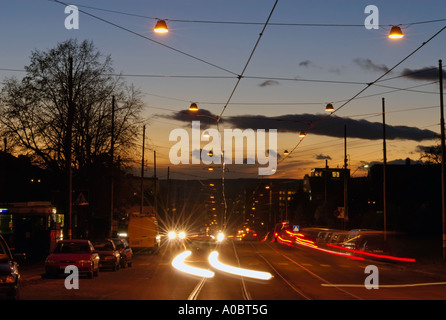 A cars light coming into a turn in front Captured during the evening in the Grefsen area of Oslo Norway in September 2006 Stock Photo