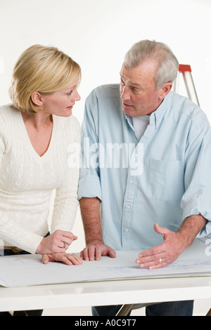 Couple working on their home Stock Photo