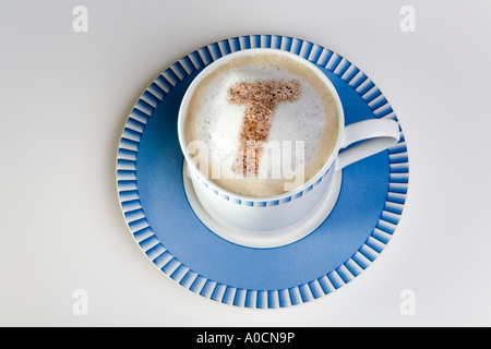 letter t in froth of cup of hot cappuccino coffee Stock Photo