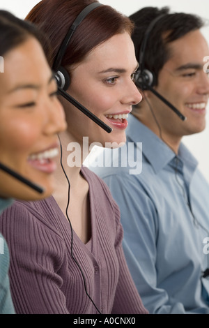 Phone operators using headsets Stock Photo