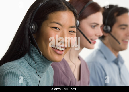 Phone operators using headsets Stock Photo
