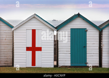 A BEACH HUT WITH A SAINT GEORGE CROSS DOOR ON THE PROMENADE AND MARINE PARADE AT PAIGNTON DEVON UK Stock Photo