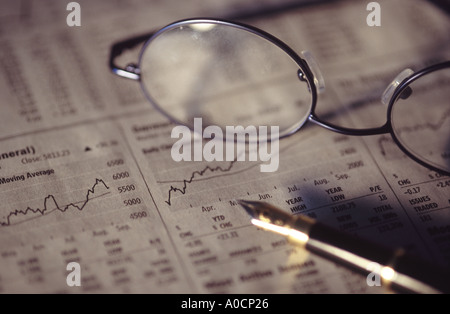 newspaper with glasses on top Stock Photo