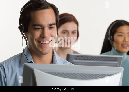 Phone operators using headsets Stock Photo