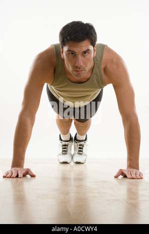 Man doing pushups Stock Photo