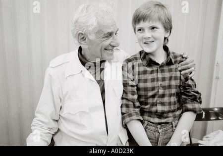 American music composer Leonard Bernstein and Welsh choir singer a young Aled Jones. Stock Photo