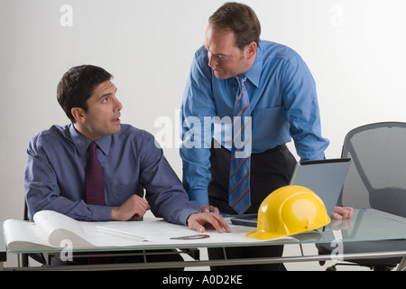 Two contractors in a meeting Stock Photo