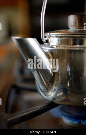 Close-up of tea kettle on gas stove burner Stock Photo