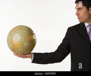 Man holding globe Stock Photo