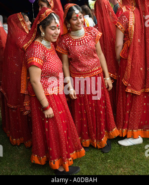 Indian dancers in traditional dress at The Mela Gunnersbury Park London UK Stock Photo