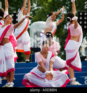 Indian modern female woman dancers in traditional dress at The Mela Gunnersbury Park London UK Stock Photo