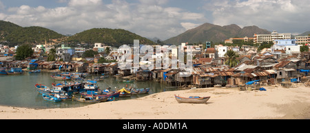 Vietnam Central Nha Trang city Cai River fishing boats and fishermens shanty settlement below Son Mountain panoramic Stock Photo