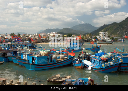 Vietnam Nha Trang city Cai River fishing boats being unloaded by smaller craft Stock Photo
