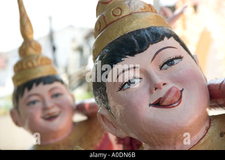 Laughing statues at the Dhammikarama Burmese Buddhist Temple in George Town Penang Stock Photo