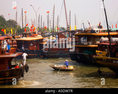 Lone small boat tourist junks in Ha Long bay, Vietnam, Southeast Asia. Stock Photo
