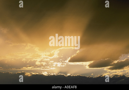 Sunset sunrise storm clouds and god or light rays Stock Photo