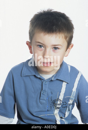 Seven Year Old Boy In Studio Portrait in the uk Stock Photo