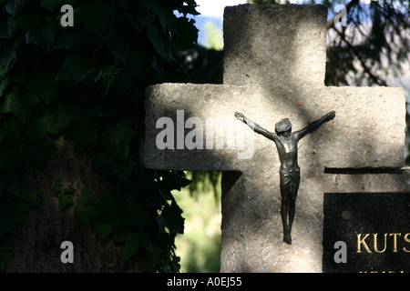 stone cross with Jesus Stock Photo