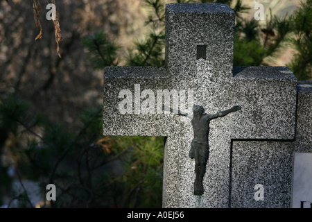 stone cross with Jesus Stock Photo