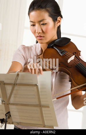 Woman playing the violin Stock Photo