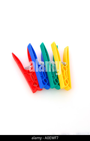 Blue green yellow and red plastic clothes pegs Stock Photo