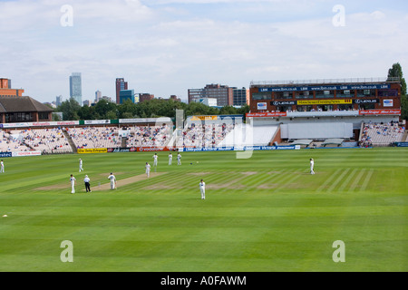 Lancashire and Yorkshire county teams playing cricket at the Old Trafford Ground in Manchester UK Stock Photo