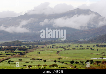 View over farmland with misty mountains beyond at Harlech Gwynedd North Wales UK Stock Photo