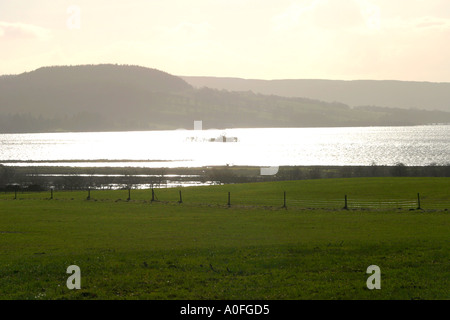 Loch Lomond Scotland looking into sun Stock Photo