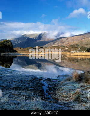 irelands irish, killarney national park, snow, christmas, highest mountain range reflected in lake covered in snow and ice Stock Photo