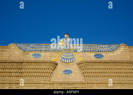 A horizontal photo of the winged symbol of the Zoroastrian religion, above the entrance of the Yazd Fire Temple, Iran.
