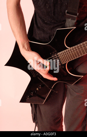 Study of a young male playing an electric guitar Stock Photo