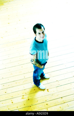 Man standing and looking up at the camera Stock Photo