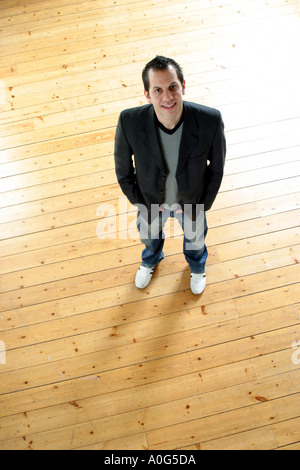 Man standing and looking up at the camera Stock Photo