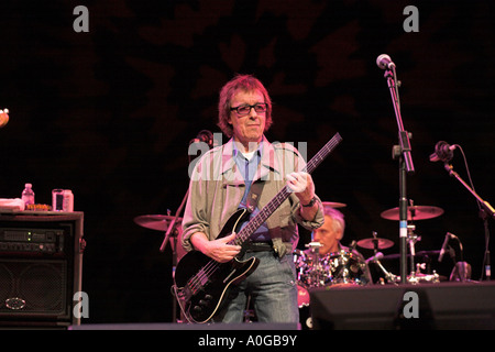 Bill Wyman playing electric bass guitar Stock Photo