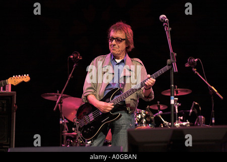 Bill Wyman playing electric bass guitar Stock Photo