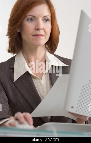 Businesswoman working on computer Stock Photo