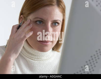 Woman focused on her computer Stock Photo