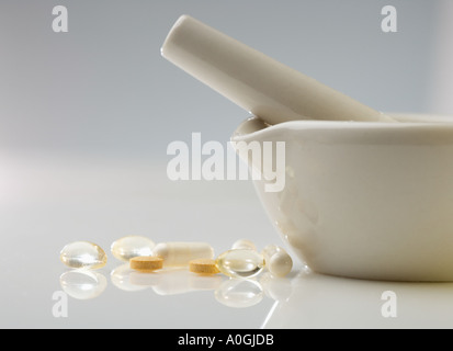Pills with mortar and pestle Stock Photo