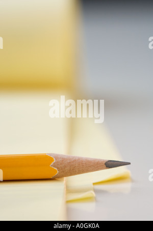 Sharpened pencil on pad of paper Stock Photo