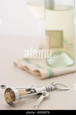 Corkscrew with bottle of white wine Stock Photo